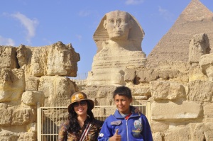 alt=" at the ancient land of egypt, school kids make a living by selling postcards to tourist"